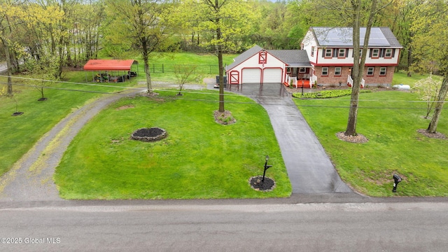 228 Maura Ln, Glenville, NY 12302 - view of front of home with an attached garage, driveway, and a wooded view
