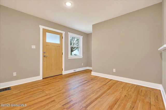 entryway featuring baseboards, recessed lighting, light wood finished floors, and visible vents
