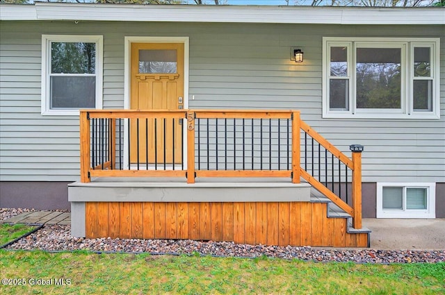 view of exterior entry featuring covered porch