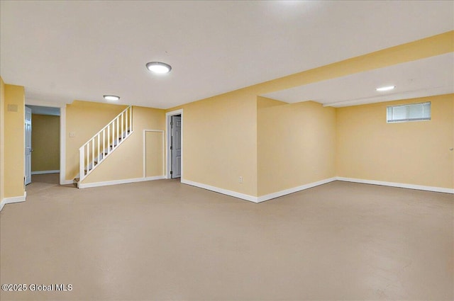 below grade area with recessed lighting, baseboards, and stairs