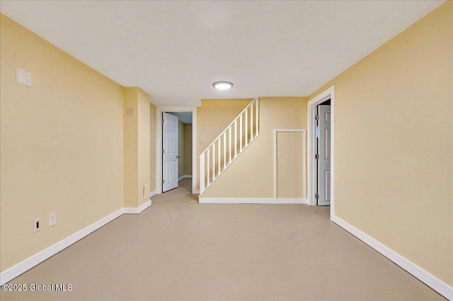 basement with baseboards, stairway, recessed lighting, and carpet floors