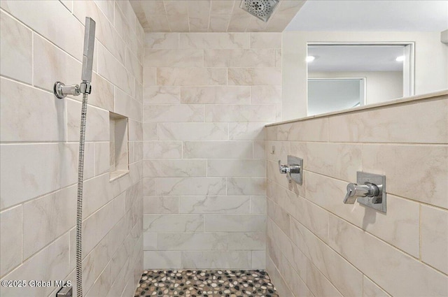full bath featuring tiled shower