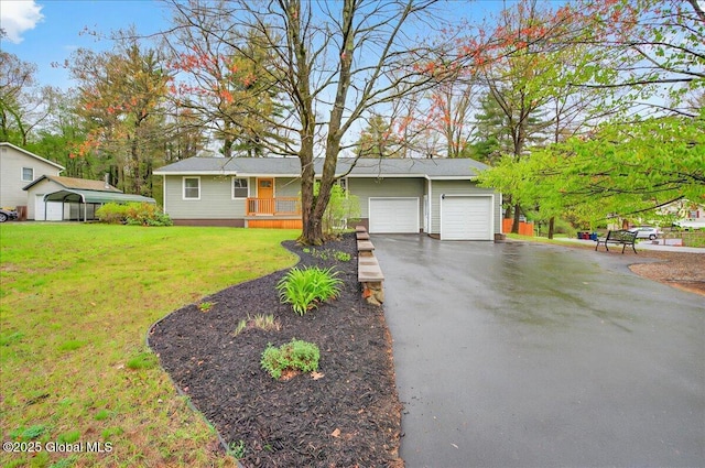 single story home featuring driveway, a front yard, and a garage