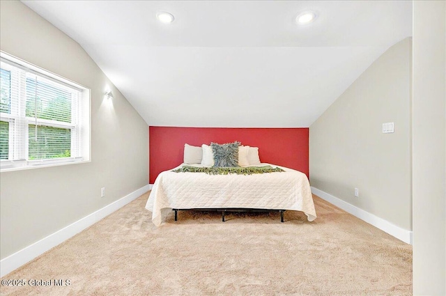 carpeted bedroom featuring lofted ceiling, baseboards, and recessed lighting