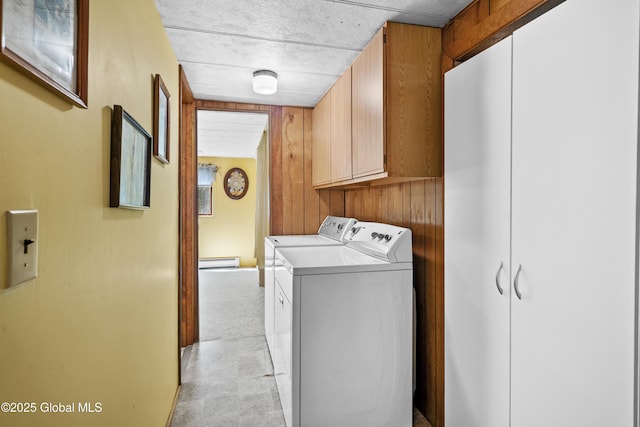28 Buyce Cross, Thurman, NY 12810 - laundry area featuring cabinet space, washing machine and dryer, baseboard heating, and wooden walls