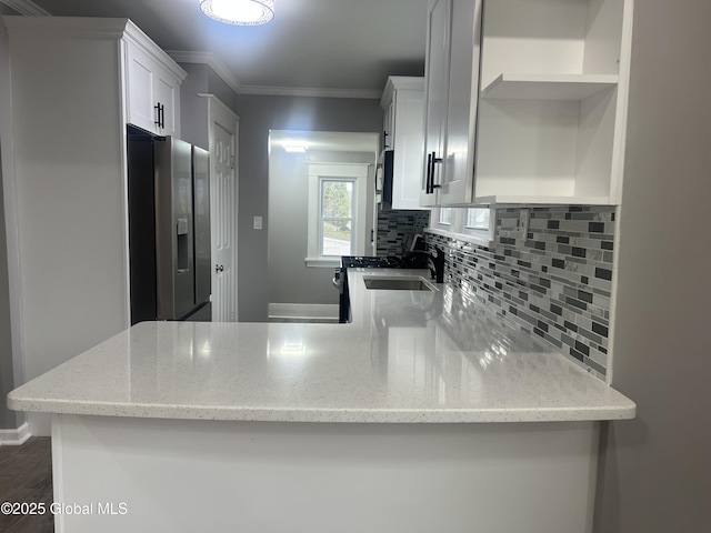 kitchen featuring open shelves, appliances with stainless steel finishes, tasteful backsplash, white cabinets, and ornamental molding