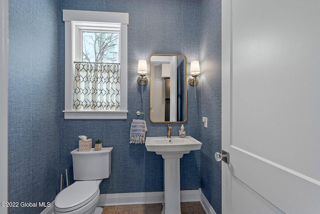11 Forest Hills Blvd, North Greenbush, NY 12144 - bathroom featuring toilet, baseboards, and a sink