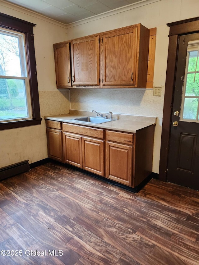 31 Fort Johnson Ave, Fort Johnson, NY 12070 - kitchen with dark wood-style flooring, brown cabinetry, and light countertops