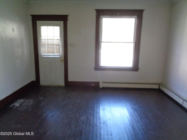 31 Fort Johnson Ave, Fort Johnson, NY 12070 - empty room featuring a baseboard radiator, baseboards, and wood finished floors