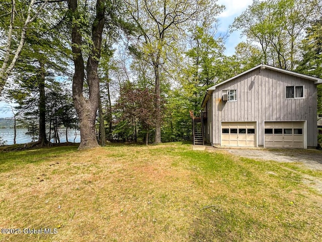 233 Cleverdale Rd, Queensbury, NY 12804 - view of grassy yard featuring a garage and stairs