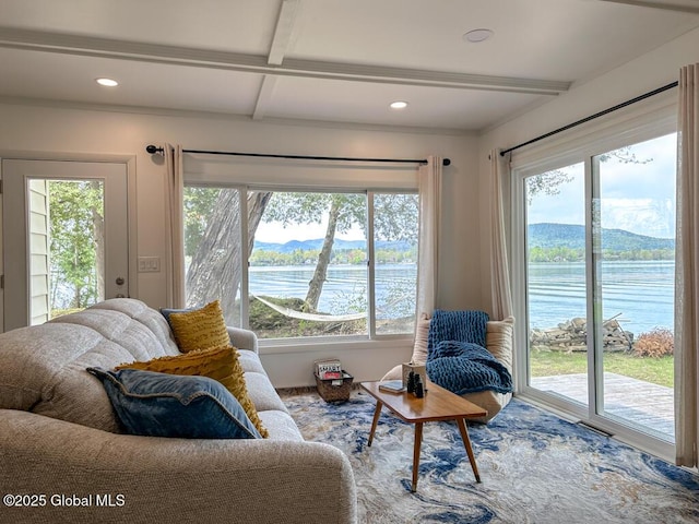 233 Cleverdale Rd, Queensbury, NY 12804 - living room featuring plenty of natural light, beamed ceiling, a water view, recessed lighting, and wood finished floors
