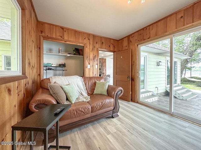 233 Cleverdale Rd, Queensbury, NY 12804 - living room with wood walls and light wood-type flooring