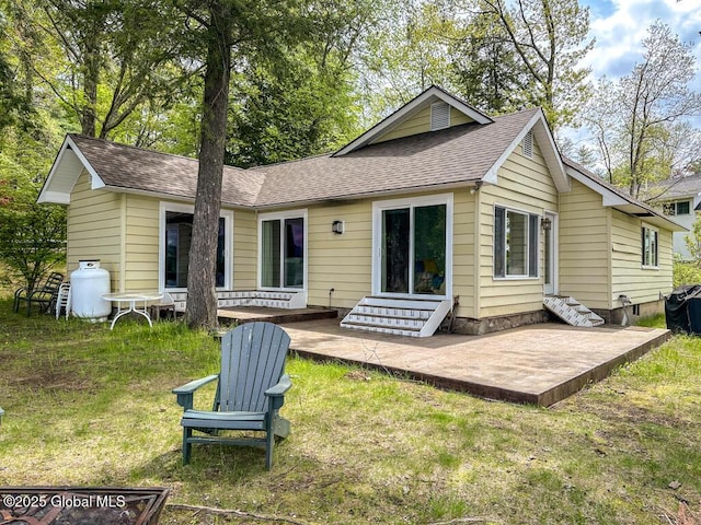 233 Cleverdale Rd, Queensbury, NY 12804 - back of property with entry steps, roof with shingles, a patio area, and a lawn