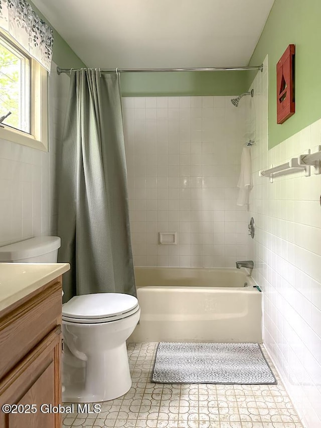 233 Cleverdale Rd, Queensbury, NY 12804 - bathroom featuring tile walls, toilet, vanity, shower / bathtub combination with curtain, and tile patterned flooring