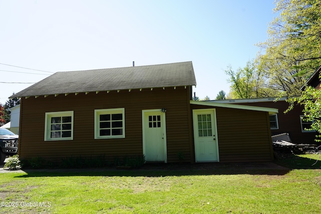 31 Thomas Ave, Hudson Falls, NY 12839 - view of front of property featuring a front yard and a shingled roof