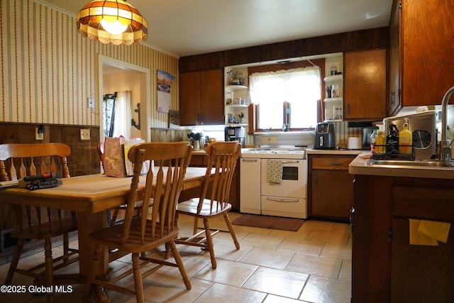 31 Thomas Ave, Hudson Falls, NY 12839 - kitchen featuring white range oven, open shelves, wallpapered walls, a sink, and a wainscoted wall
