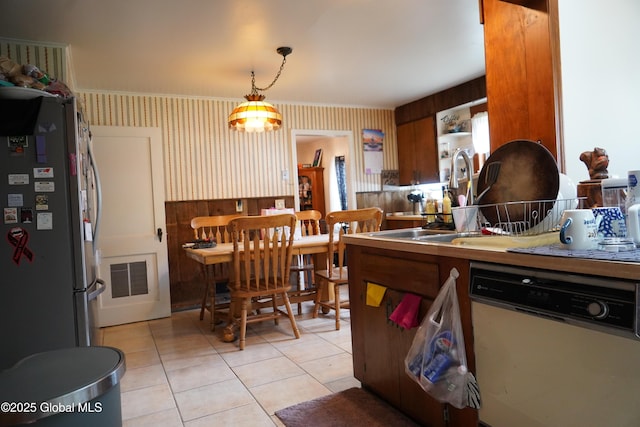 31 Thomas Ave, Hudson Falls, NY 12839 - kitchen with dishwasher, freestanding refrigerator, wallpapered walls, light tile patterned floors, and hanging light fixtures