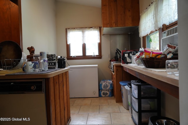 31 Thomas Ave, Hudson Falls, NY 12839 - kitchen featuring fridge, white dishwasher, brown cabinets, and light tile patterned floors