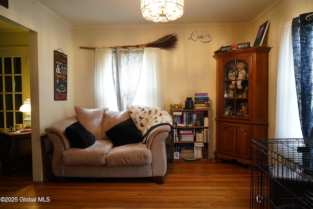 31 Thomas Ave, Hudson Falls, NY 12839 - sitting room featuring a chandelier, wood finished floors, and ornamental molding