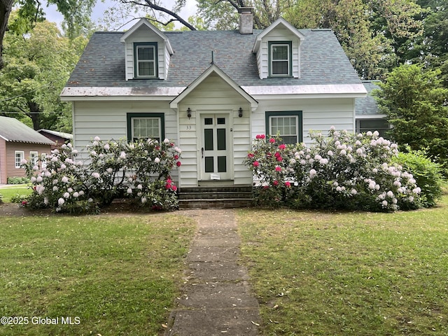 31 Thomas Ave, Hudson Falls, NY 12839 - cape cod home with a front lawn, a chimney, and a shingled roof