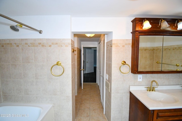 full bathroom with a tub to relax in, tile patterned floors, tile walls, a shower, and vanity