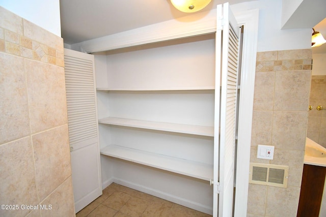 closet featuring visible vents