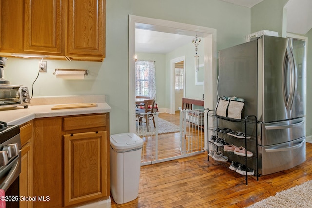 99 Otsego St, Canajoharie, NY 13317 - kitchen featuring appliances with stainless steel finishes, light wood-style floors, and light countertops