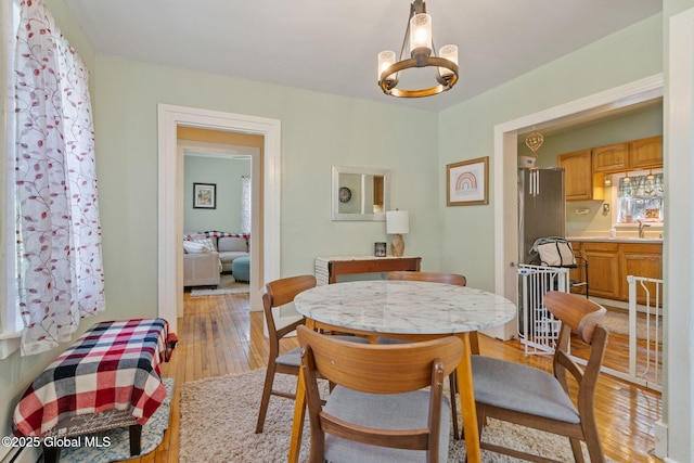 99 Otsego St, Canajoharie, NY 13317 - dining space featuring light wood-style floors and a chandelier