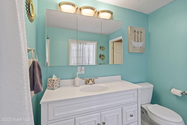 99 Otsego St, Canajoharie, NY 13317 - bathroom with a textured ceiling, toilet, tasteful backsplash, and vanity