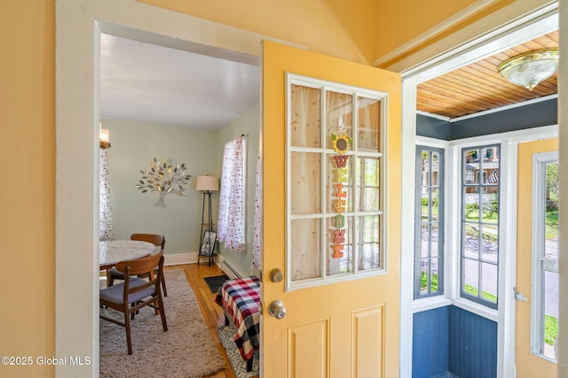99 Otsego St, Canajoharie, NY 13317 - doorway to outside featuring wood finished floors and baseboards