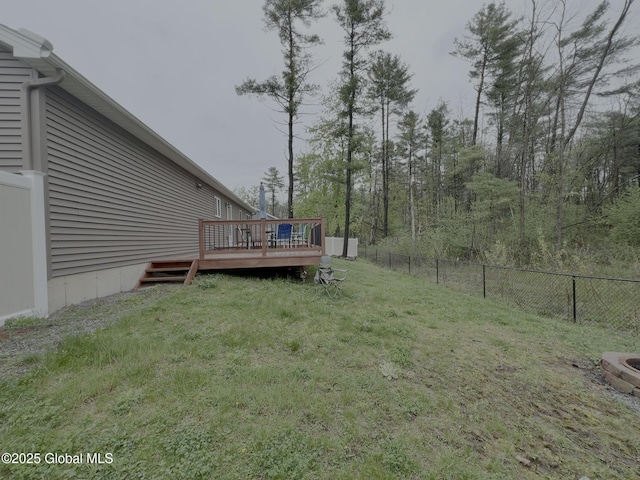 view of yard featuring a wooden deck