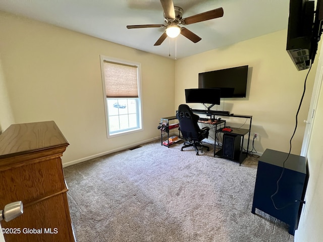 office area featuring carpet floors, ceiling fan, and baseboards