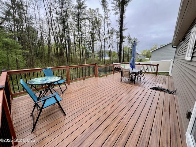 wooden terrace with outdoor dining area