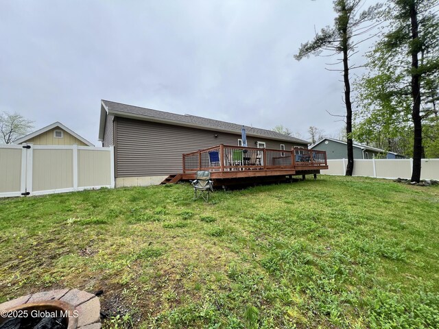 back of house featuring a wooden deck
