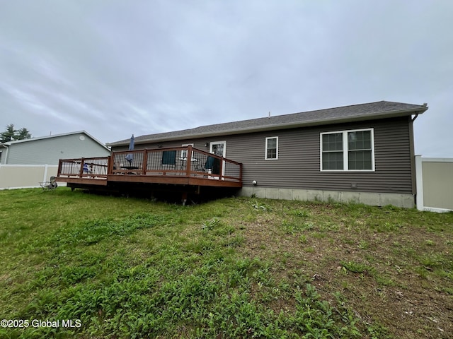 rear view of property featuring a wooden deck