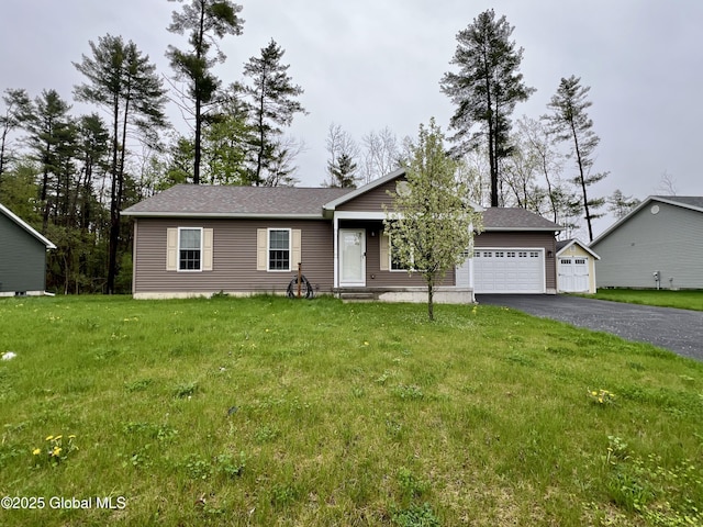 ranch-style house with asphalt driveway, an attached garage, and a front yard