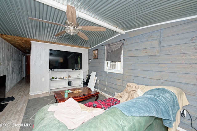 17-19 Smith Ct, North Greenbush, NY 12198 - living area featuring wooden walls, wood finished floors, ceiling fan, vaulted ceiling, and cooling unit