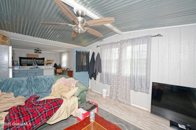 17-19 Smith Ct, North Greenbush, NY 12198 - living area featuring wood finished floors, ceiling fan, wooden walls, and baseboards