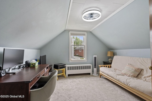 office space featuring radiator, ceiling fan, carpet, and lofted ceiling