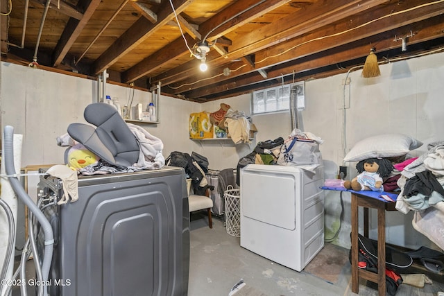 below grade area featuring washing machine and dryer