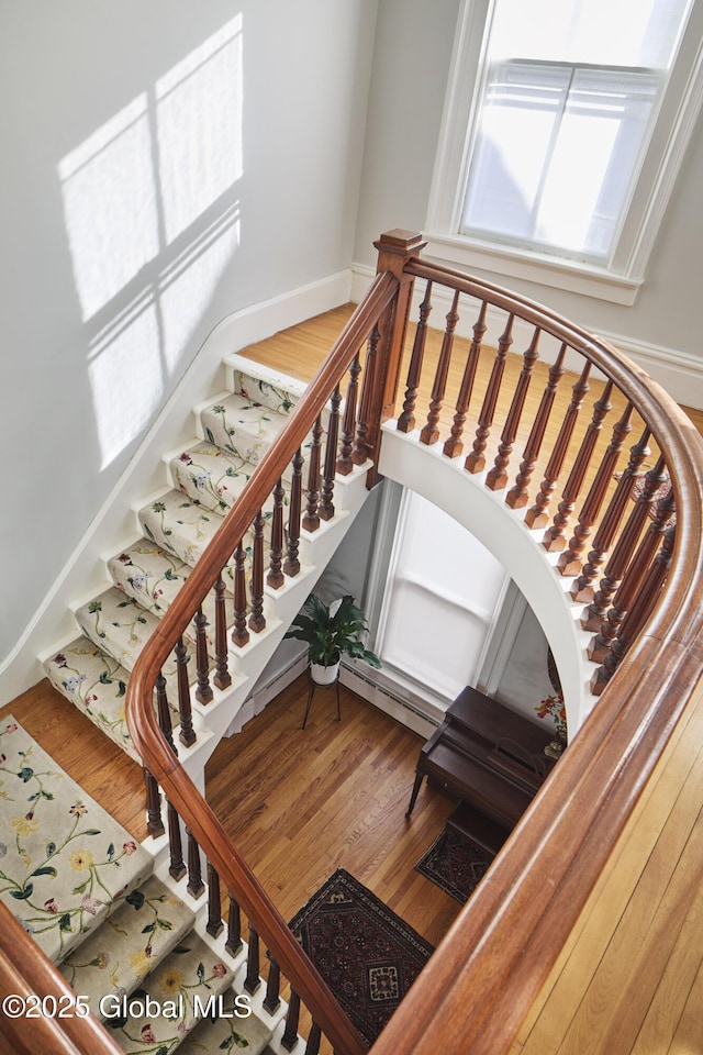 stairway with wood finished floors