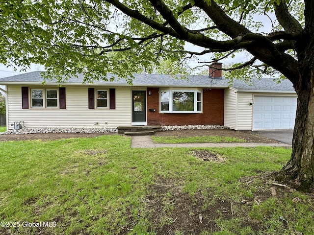 ranch-style home featuring a chimney, a front yard, asphalt driveway, a garage, and brick siding