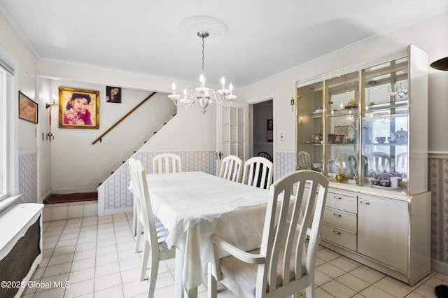 1834 Western Ave, Guilderland, NY 12203 - dining room featuring a chandelier, a wainscoted wall, and plenty of natural light