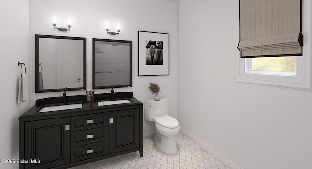 full bath featuring double vanity, toilet, and baseboards