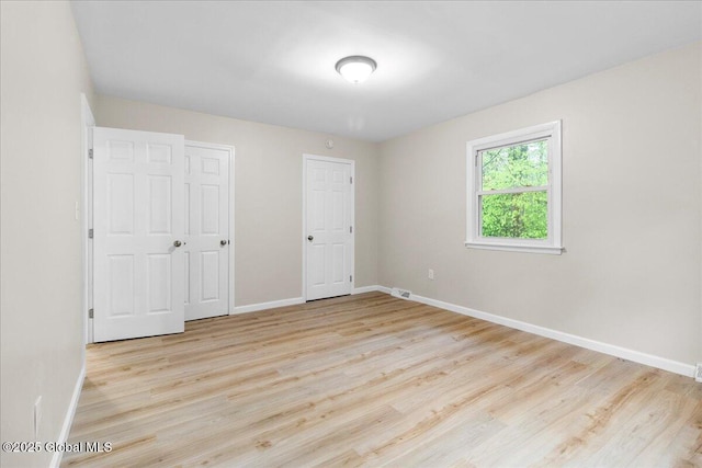 292 Stone Church Rd, Ballston Spa, NY 12020 - unfurnished bedroom with baseboards and wood finished floors