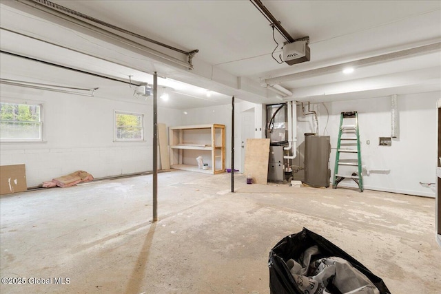 292 Stone Church Rd, Ballston Spa, NY 12020 - garage featuring gas water heater, a garage door opener, and heating unit