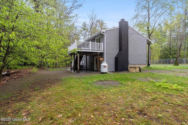 292 Stone Church Rd, Ballston Spa, NY 12020 - back of house with a wooden deck and a chimney