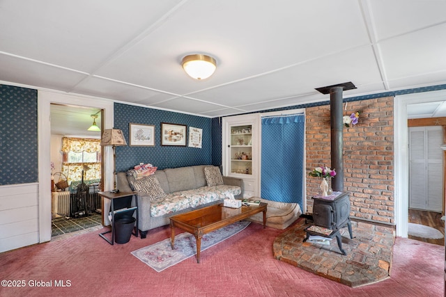 12098 Duanesburg Rd, Duanesburg, NY 12053 - carpeted living room with a wood stove, wallpapered walls, and wainscoting