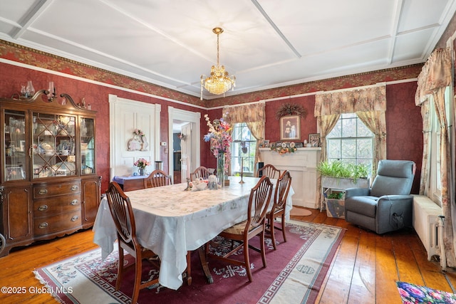 12098 Duanesburg Rd, Duanesburg, NY 12053 - dining space featuring hardwood / wood-style flooring, a chandelier, and wallpapered walls