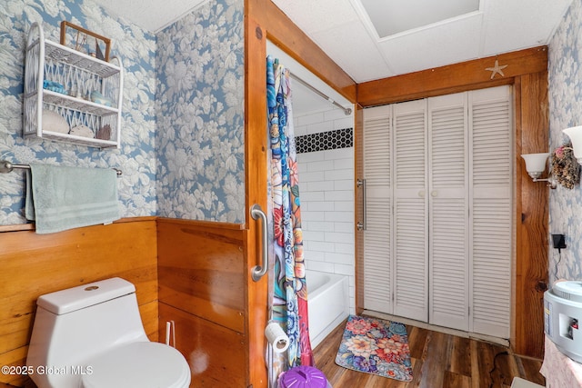 12098 Duanesburg Rd, Duanesburg, NY 12053 - full bathroom featuring wallpapered walls, wood finished floors, a closet, wainscoting, and toilet
